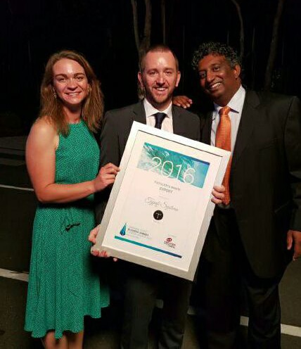 Typefi Marketing Associate Shanna Bignell, Financial Controller Michael Cousins and CEO Chandi Perera holding up the 2016 Sunshine Coast Business Awards Excellence Award for Export.