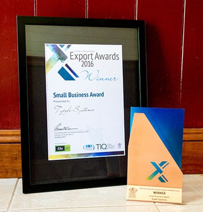 Typefi's framed certificate and trophy from the 2016 Premier of Queensland's Export Awards