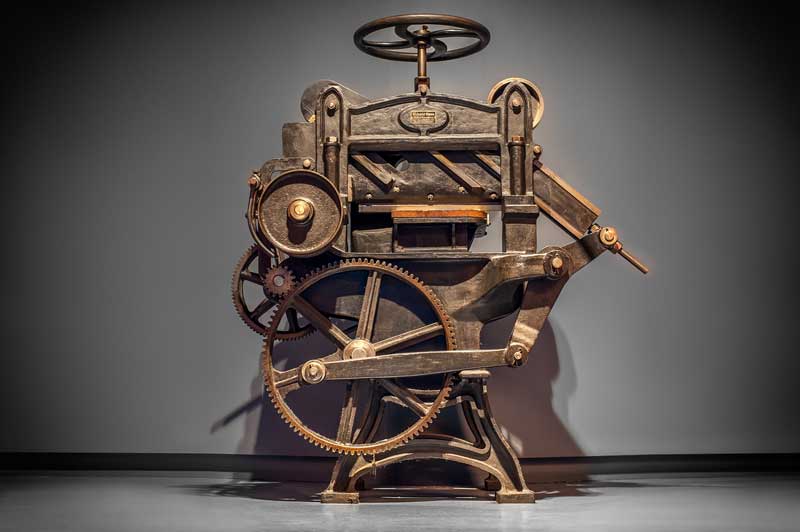 Stock photo of an antique printing press.