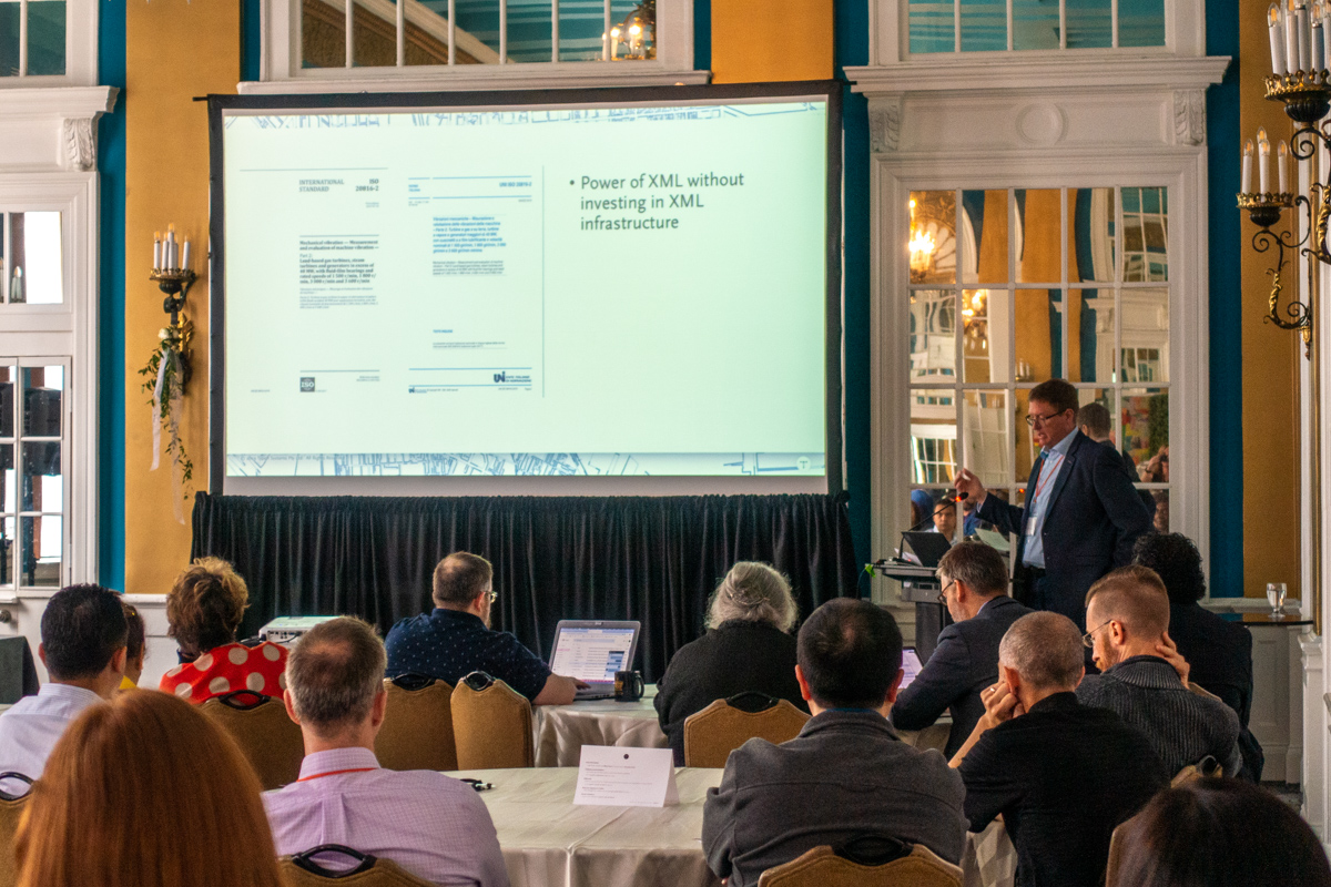 Jason Mitchell presenting at the 2019 Typefi User Conference. The screen reads: "Power of XML without investing in XML infrastructure."