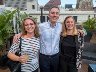 Shanna Bignell and Eric Damitz smile for the camera in the rooftop bar.