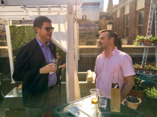 Per Thrane-Nielsen and Jim Cain chat over a drink in the sunny rooftop bar..