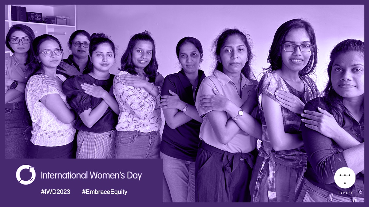 Promotional image of 9 women at Typefi embracing themselves for International Women's Day 2023 theme: embrace equity.