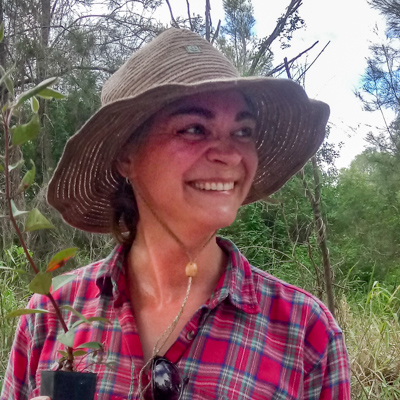 Shanna Bignell holding a seedling ready for planting.