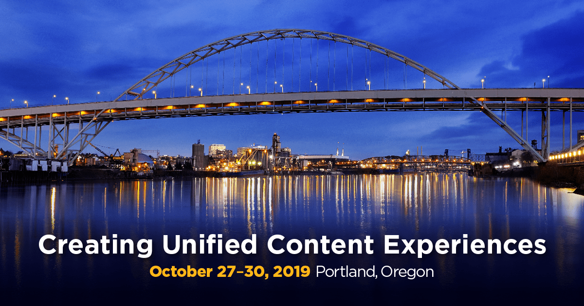 LavaCon banner featuring an evening shot of a the Fremont Bridge in Portland, Oregon. The bridge spans the Willamette River, and lights from a row of buildings along the shoreline are reflected in the water. Overlaid text reads 'Creating Unified Content Experiences, October 27-30 2019, Portland Oregon'.