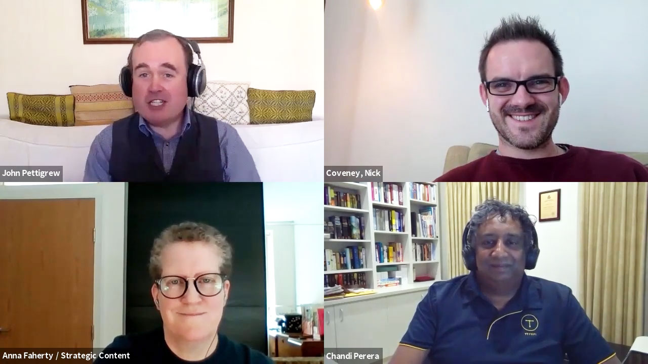 A screenshot showing four panel speakers on a group call.
