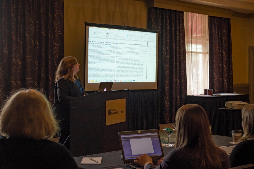 Typefi Solutions Consultant Jamie Brinkman demonstrates Typefitter, an Adobe InDesign plug-in, on a large screen in front of the audience at the 2017 Typefi User Conference.