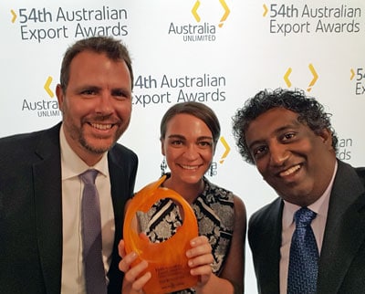 Typefi VP Engineering Ben Hauser, Marketing Associate Shanna Bignell, and CEO Chandi Perera, hold up their trophy after winning the Small Business Award at the 54th Australian Export Awards in Brisbane.