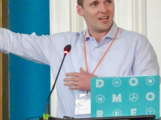 Guy van der Kolk gestures at the screen during his 2019 Typefi User Conference presentation.