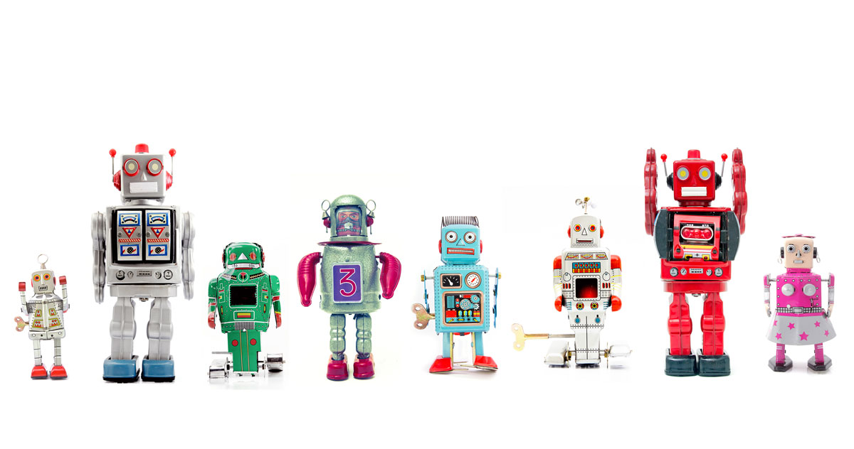 A line of colourful toy tin robots.